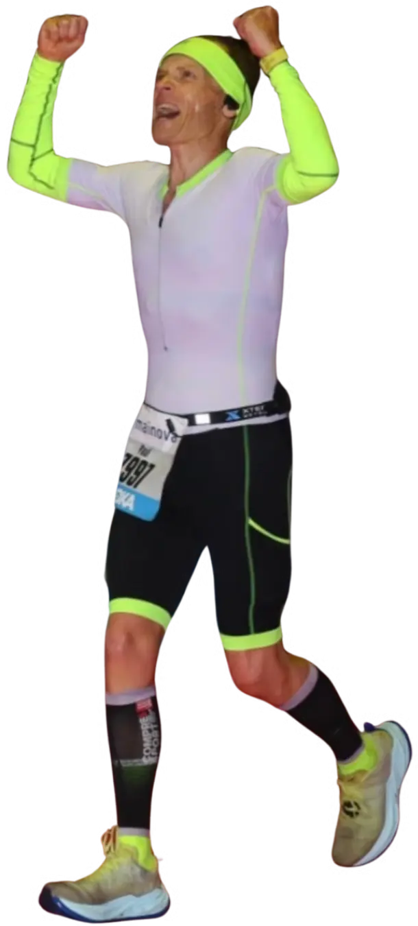 Female runner celebrating achieving marathon success with Pacehub Pro training plan